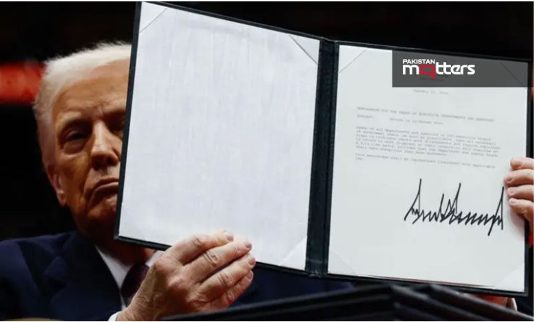trump posing with executive order signing