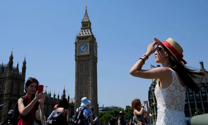 Britain bakes as heat wave brings record